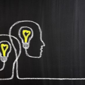 Teamwork Light Bulbs concept on blackboard