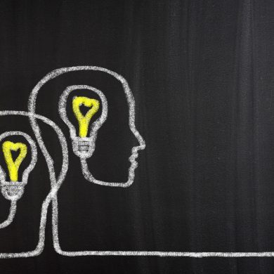 Teamwork Light Bulbs concept on blackboard